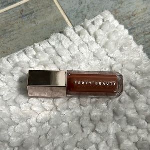 Gently Beauty Gloss Bomb, Fenty Glow; 9mL bottle.